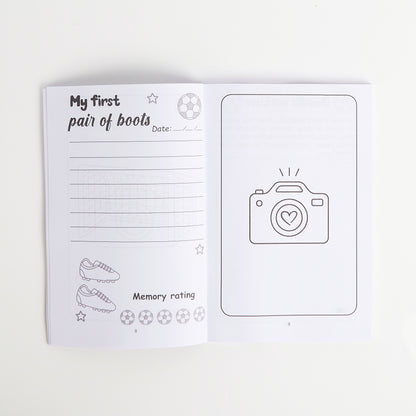 Notebook with a page titled 'My first pair of boots' and a camera icon on a white background